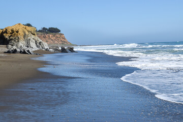 Central California coast rocks waves sand