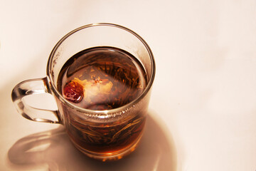 glass transparent cup with a delicious drink of herbs and flowers