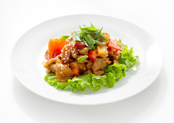 Roasted meat with vegetables and fresh salad, a dish in a plate on a white background, isolate