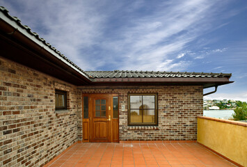 Clasic norwegian brick house and blue sky