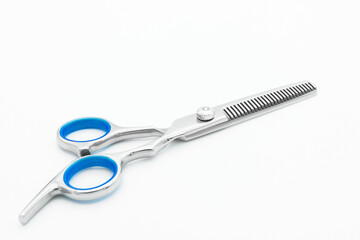 Close-up view of the teeth blade scissor isolated on white background.
