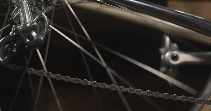 Close up of vintage bike pedaling, chain moving, rear derailleur turning