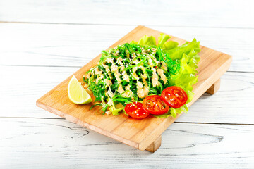 Chuka Salad on wooden board. Vegetarian food. Traditional japanese cuisine.