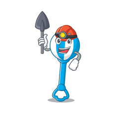 A cartoon picture of rattle toy miner with tool and helmet