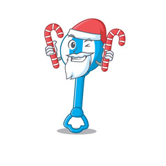 Friendly rattle toy dressed in Santa Cartoon character with Christmas candies
