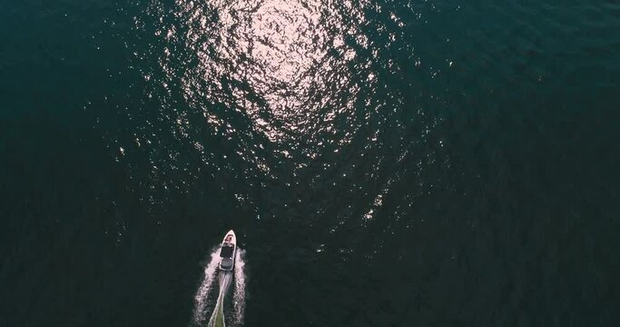 Speed boating on sunny day, aerial drone shot, Lake Norman, NC