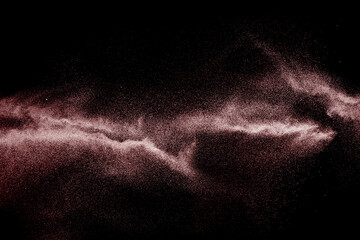 Freeze motion of brown dust explosion.Stopping the movement of brown powder.Explosive brown powder...