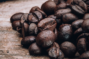 coffee beans on wooden log in the foreground