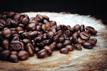 coffee beans on wooden log