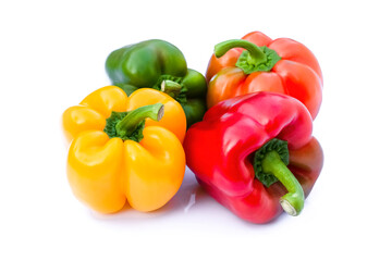 Closeup fresh whole and colors ; green, red, yellow bell peppers or capsicum isolated on white background.