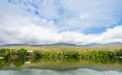 landscape lake views at Ang Kaew Chiang Mai University in nature forest Mountain views spring blue sky background with white cloud.