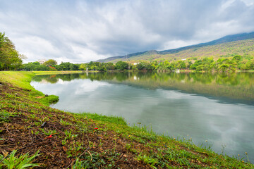 landscape lake views at Ang Kaew Chiang Mai University in nature forest Mountain views spring blue sky background with white cloud.