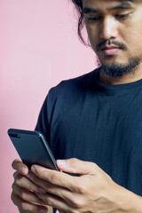 Asian men are using mobile phones.