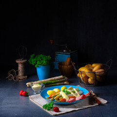 Asparagus with black forest ham, carrots and hollandaise sauce.