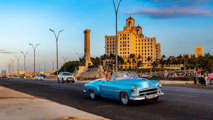 Poster Sunset in Old Havana Cuba, with the street lights of El Malecon. Latin, cityscape. © Daniel Avram