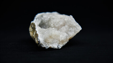 White crystal with a black background