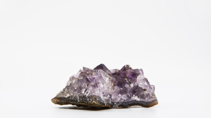 Purple crystal with a white background