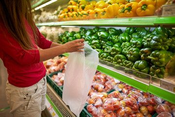       woman puts food in the store  