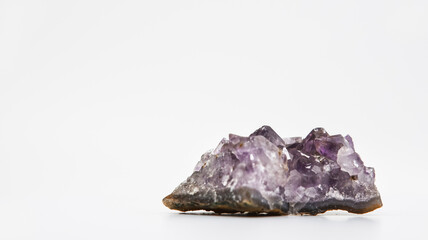 Purple crystal with a white background
