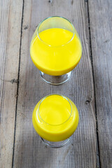 Golden milk in a glass of cognac cognac glass