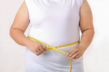 fat woman measuring her fat belly. - obrazy, fototapety, plakaty