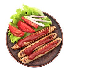 fried sausages with lettuce on a plate
