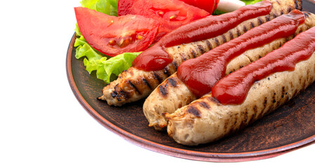grilled sausages on a plate with vegetables