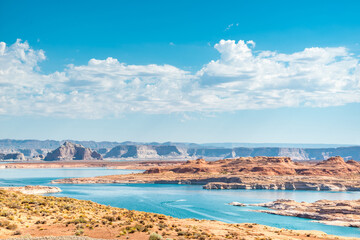 Fototapeta premium Beautiful orange rock formation at Lake Powell and Glen Canyon Dam in the Glen Canyon National Recreation Area Desert of Arizona and Utah, United States