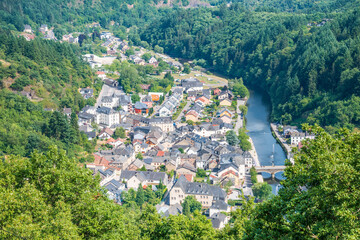 Fototapeta na wymiar Aerial view of the small tourist city of Vianden in Luxembourg with the river Our next to it.