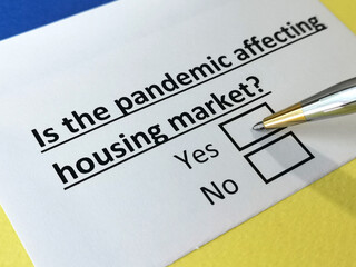 Obraz premium One person is answering question about how pandemic affecting housing market.