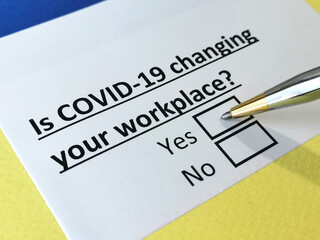 Obraz premium One person is answering question about covid-19 effects on workplace.