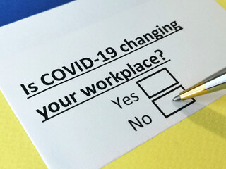 Obraz premium One person is answering question about covid-19 effects on workplace.