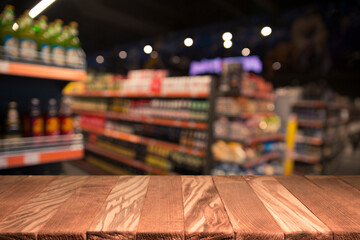 Wood top table on blur supermarket background
