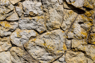 Old wall of wild stone, texture