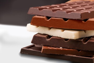 Stack delicious chocolates on white desk