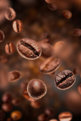 coffee beans falling in front of blurred background