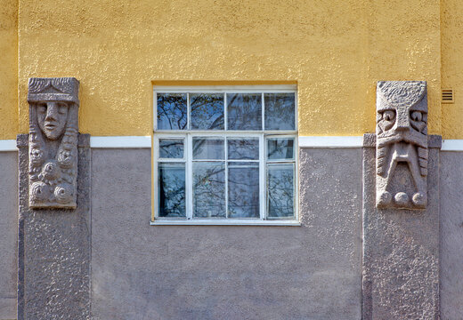 The decor of the main facade is grotesque faces - mascarons carved in granite. House of Pietinen. Vyborg. Russia