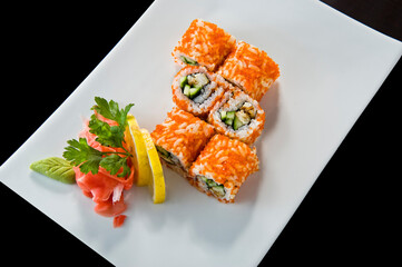 Sushi roll with salmon and shrimp tempura.