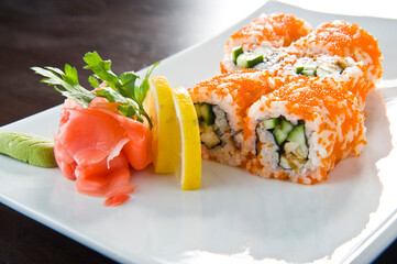 Sushi roll with salmon and shrimp tempura.