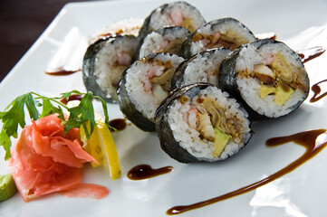 Sushi roll with salmon and shrimp tempura.