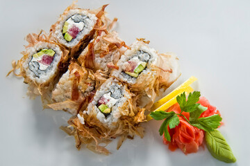 Sushi roll with salmon and shrimp tempura.
