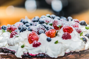 Delicious sweet cake with different fresh fruit. Sweet homemade cake. Closeup.