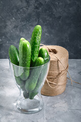 Macro photo of a food vegetable cucumber in a glass vase. Texture background ripe juicy juicy vegetables cucumbers. Image of vegetable green cucumber food product