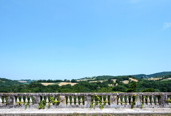 Italian landscape, view from a balustrade terrace  of green hills italian