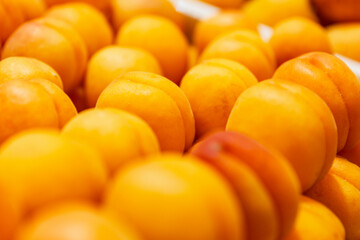Ripe juicy apricots on the counter. Health and vitamins. Close-up. Background. Space for text.