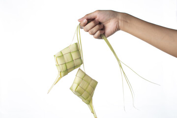 Fototapeta na wymiar Ketupat (Rice Dumpling) On isolated Background. Ketupat is a natural rice casing made from young coconut leaves for cooking rice during eid Mubarak, Eid ul Fitr