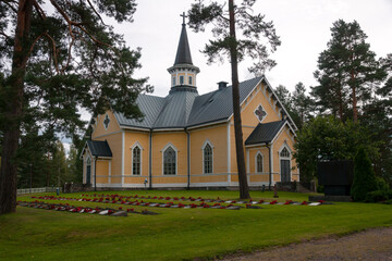 Fototapeta na wymiar New Pihlajavesi Church and memorial cemetery. Pihlajаvesi (Petäjävesi) is municipality of Finland 
