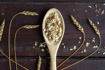 Spoon with oatmeal on a wooden background. Healthy lifestyle