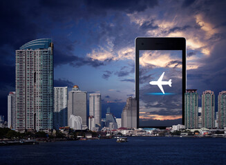 Airplane flat icon on modern smart mobile phone screen over office city tower, river and sunset sky, Business plane transportation online concept