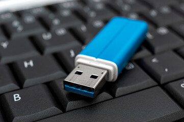 Flash drive on the laptop keyboard.